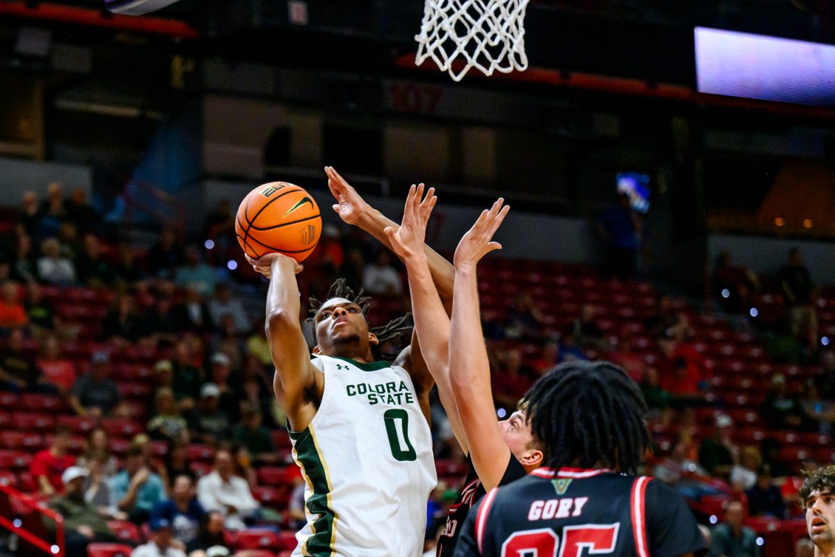 Colorado State University men's basketball forward Carey Booth (0) launches the ball at the hoop during CSU's game against Fresno State University in the Mountain West tournament March 11. Booth went 6-of-8 for free throws and contributed six rebounds during the game. 