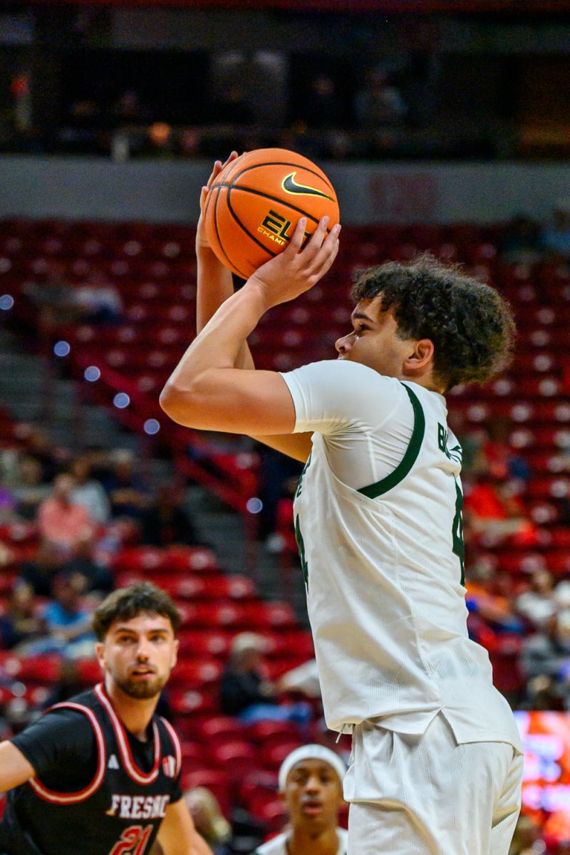 Colorado State University men's basketball guard Jase Butler (4) attempts a 3-pointer during CSU's game against Fresno State University in the Mountain West tournament March 11. 