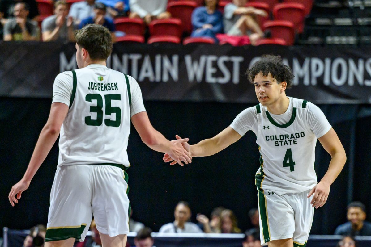 Colorado State University men's basketball forward Kyle Jorgensen (35) high fives guard Jase Butler (4) after scoring against Fresno State University in the Mountain West tournament March 11. 
