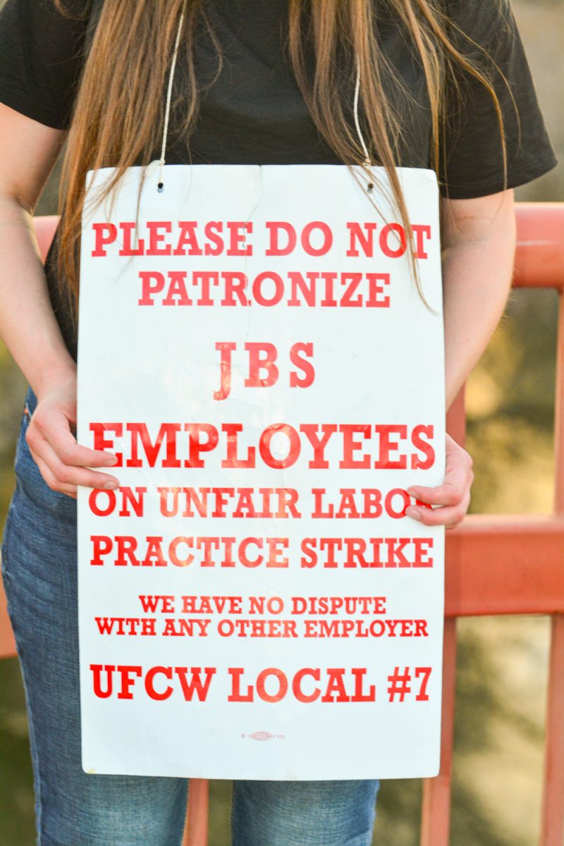 One of the many JBS employees on strike after the company increased the speed of their production lines and reduced their hours March 25. These workers are fighting for safer, fairer conditions "They speed up our chain line, and it makes us run faster and it makes the cows go by faster, so we do more and then it cuts our hours." A protestor who requested anonymity stated " We are all out here fighting for our rights." 