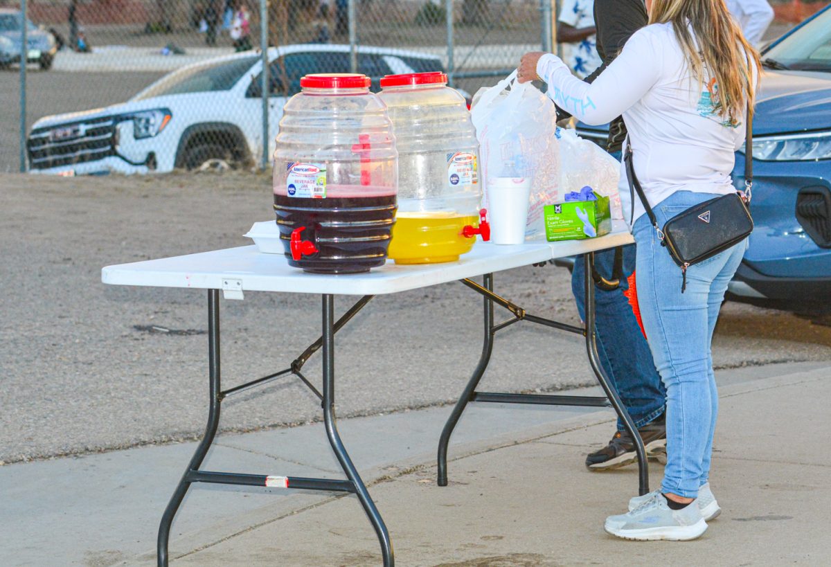 A drink station being set up for protestors outside of JBS March 25. Outside of JBS there are hundreds of scattered workers protesting for fair wages and better working conditions. 