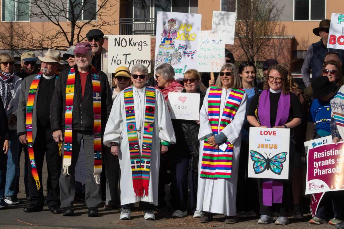 Local faith leaders pose for a photo after an inter-faith gathering that took place before the No Kings protest outside the First Presbyterian Church March 28. Krista Dias, the priest at St. Lukes Episcopal Church, led the group in song and prayer before they attended the rally in Civic Center Park. “We wanted to ground ourselves in prayer and peace and justice before we go so our heads and minds and spirits are in the right frame of mind to do this work,” Dias said.