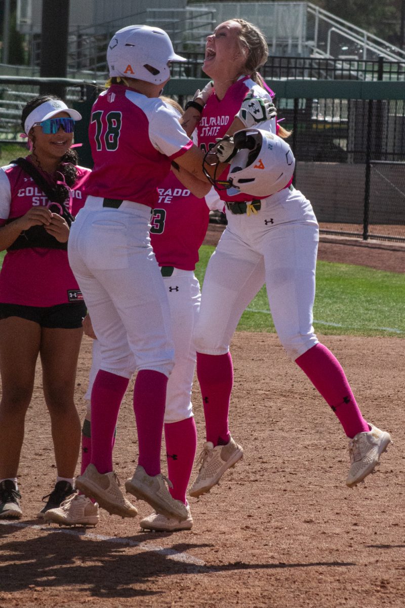 Sophomore Kyra Smith (22) celebrates with freshman Rylee Gonzales after Smith’s walk-off hit at the end of Colorado State University's Pink Out and Colors for a Cause game against Boise State at the CSU Softball Field Mar. 29. Smith brought the Rams from a 4-6 deficit to a 7-6 win at the bottom of the seventh inning.