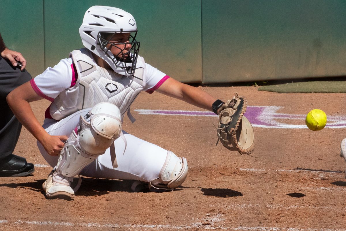 Freshman Bradie Poteet-Herrera catches a pitch during the second inning of Colorado State University’s Pink Out game against Boise State at the CSU Softball Field Mar. 29. The Rams won 7-6.