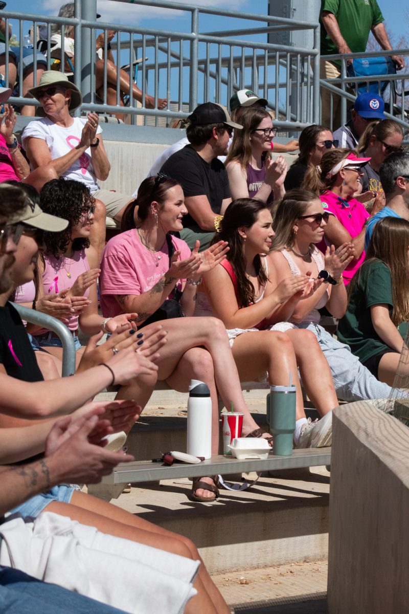 Spectators applaud after freshman Olivia Schmidt catches a ball during Colorado State University’s Pink Out and Colors for a Cause game against Boise State at the CSU Softball Field Mar. 29. The Rams won 7-6 in a walk-off win.