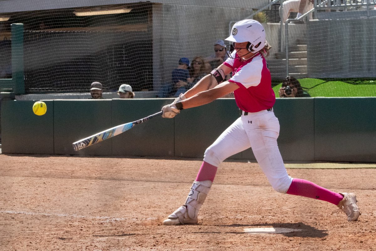 Sophomore Lauren Stucky swings and hits the ball during Colorado State University’s Pink Out and Colors for a Cause game against Boise State at the CSU Softball Field Mar. 29. The Rams won 7-6 in a walk-off win.