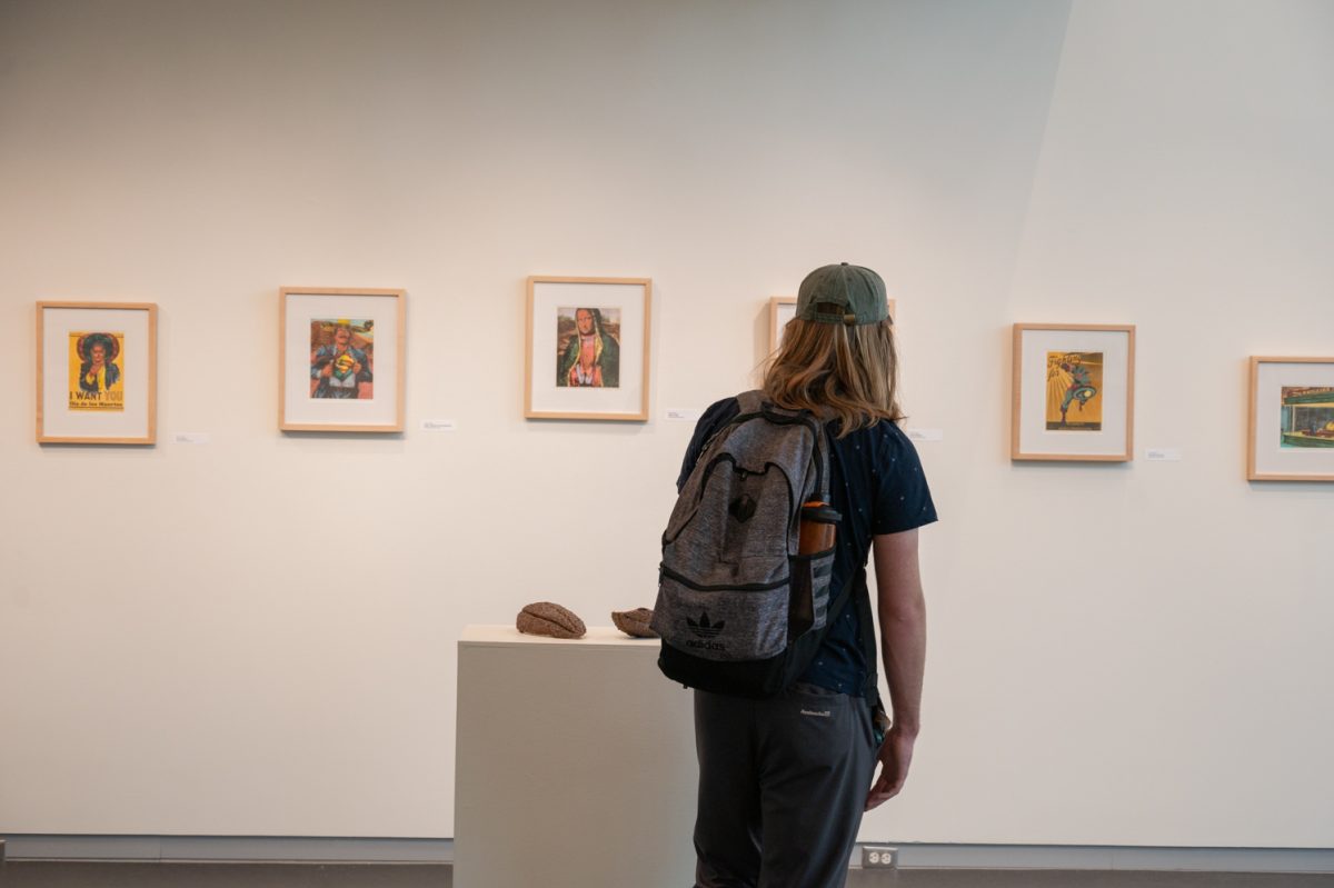 Noah Bergdorf, a Colorado State University student with a deep interest in engaging with the arts, explores the Hilo y Tierra showcase in his free time between classes March 30. As part of his college experience Bergdorf makes the effort to engage with as much campus art as possible and stopped to take a peek at the gallery on display. “In college there are just so many different opportunities to see art,” Bergdorf said. “I’ve always wanted to see the exhibit here and saw it was open so I just walked in and started looking at all the stuff.”