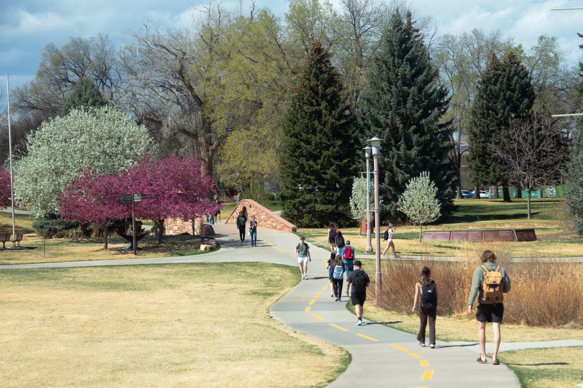 CSU students walk along the sideline outside the Lory Student Center March 26.