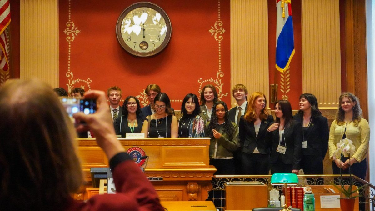 Members of the Associated Students of Colorado State University and guests stand at the front of the Colorado State Senate Chambers March 31 during the Day at the Capitol event. State lawmakers met with students to encourage participation in the civic process. 