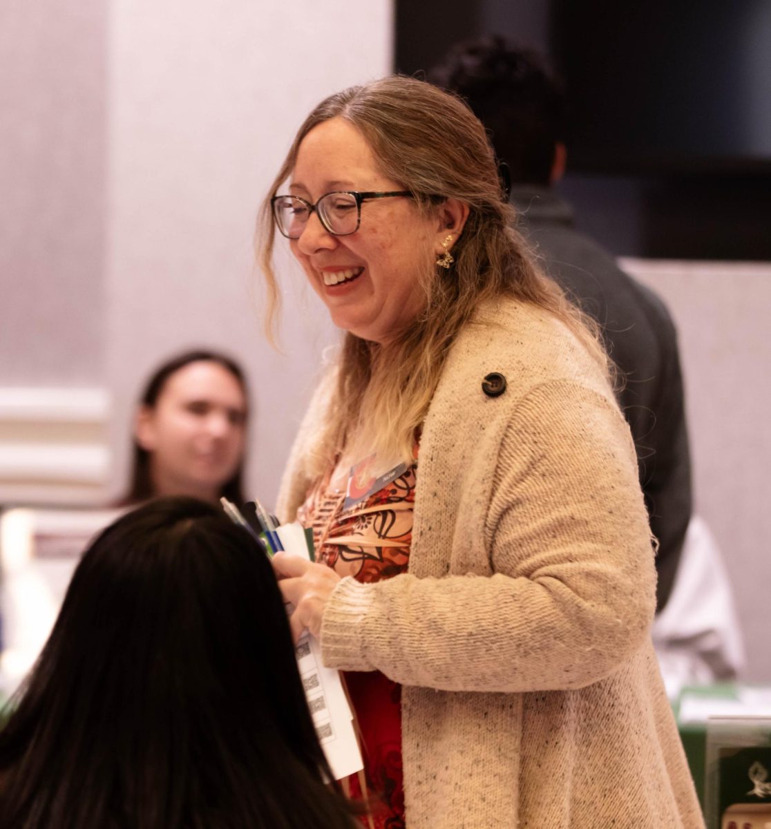 Civic Engagement Fair participant laughs during event at Colorado State University's Lory Student Center, March 9.