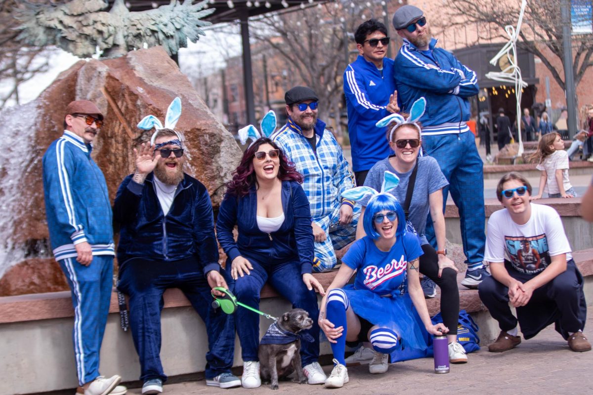 Easter Keg Scavenger Hunt group poses for a photo while laughing during the event in Old Town Fort Collins, March 28.