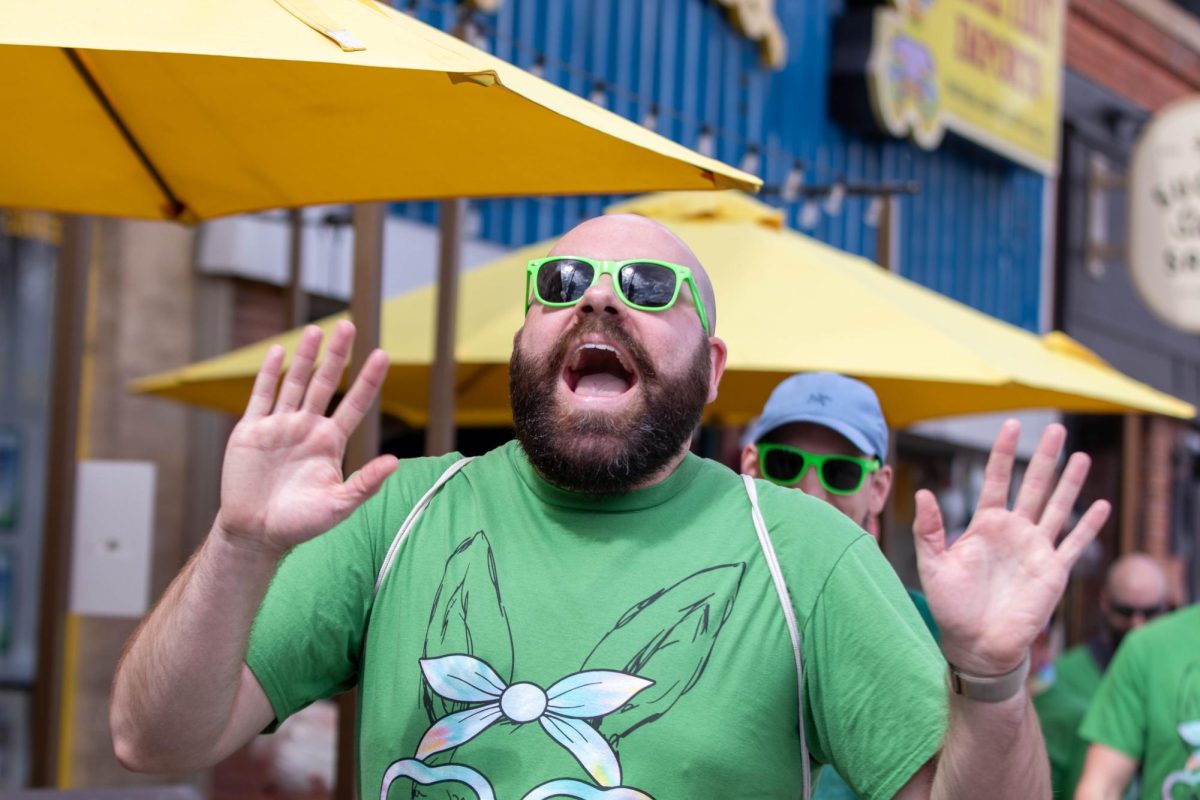 Easter Keg Scavenger Hunt participant laughs during the hunt  in Old Town Fort Collins, March 28.