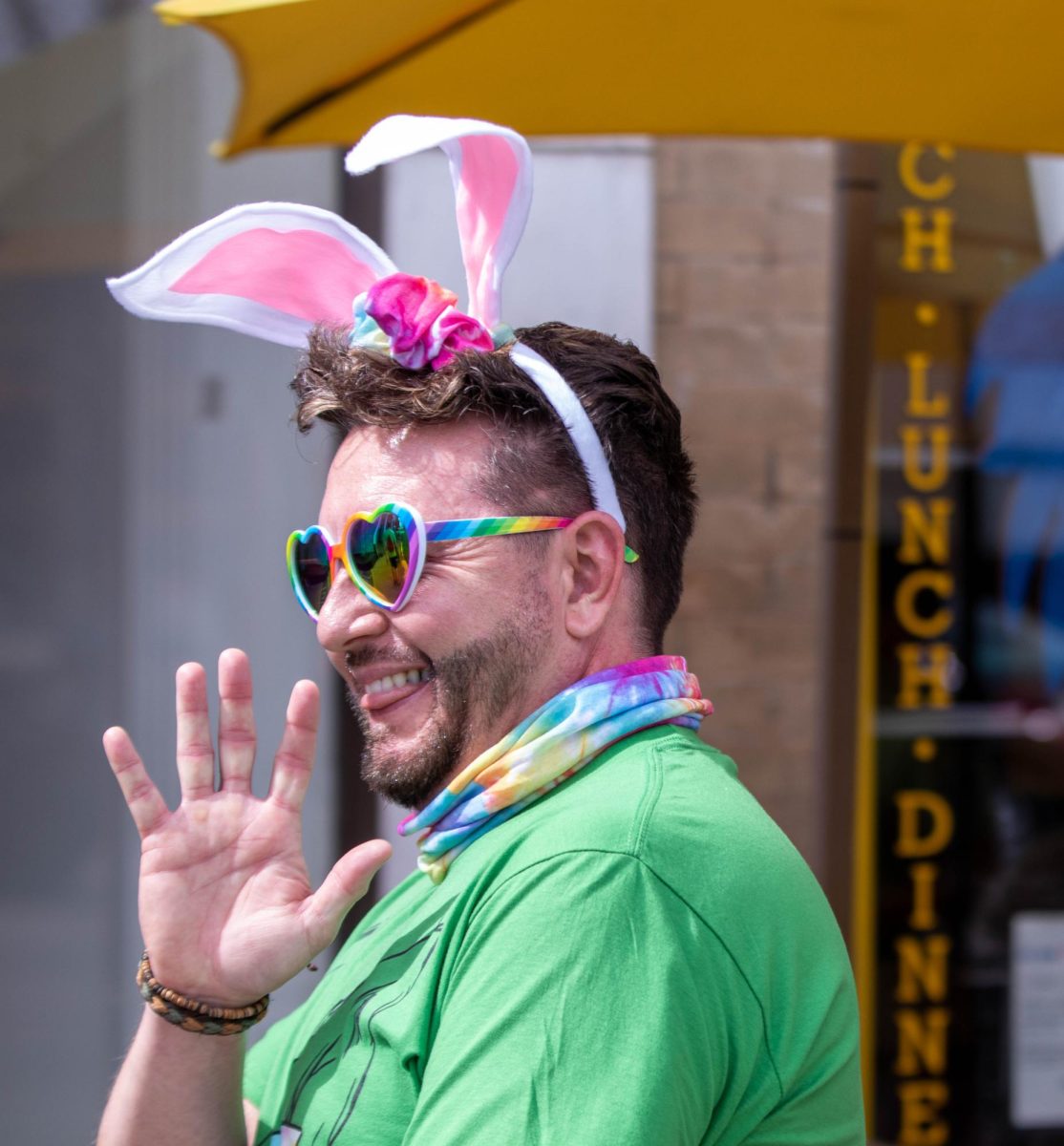 Easter Keg Scavenger Hunt participant waves during the event in Old Town Fort Collins, March 28.