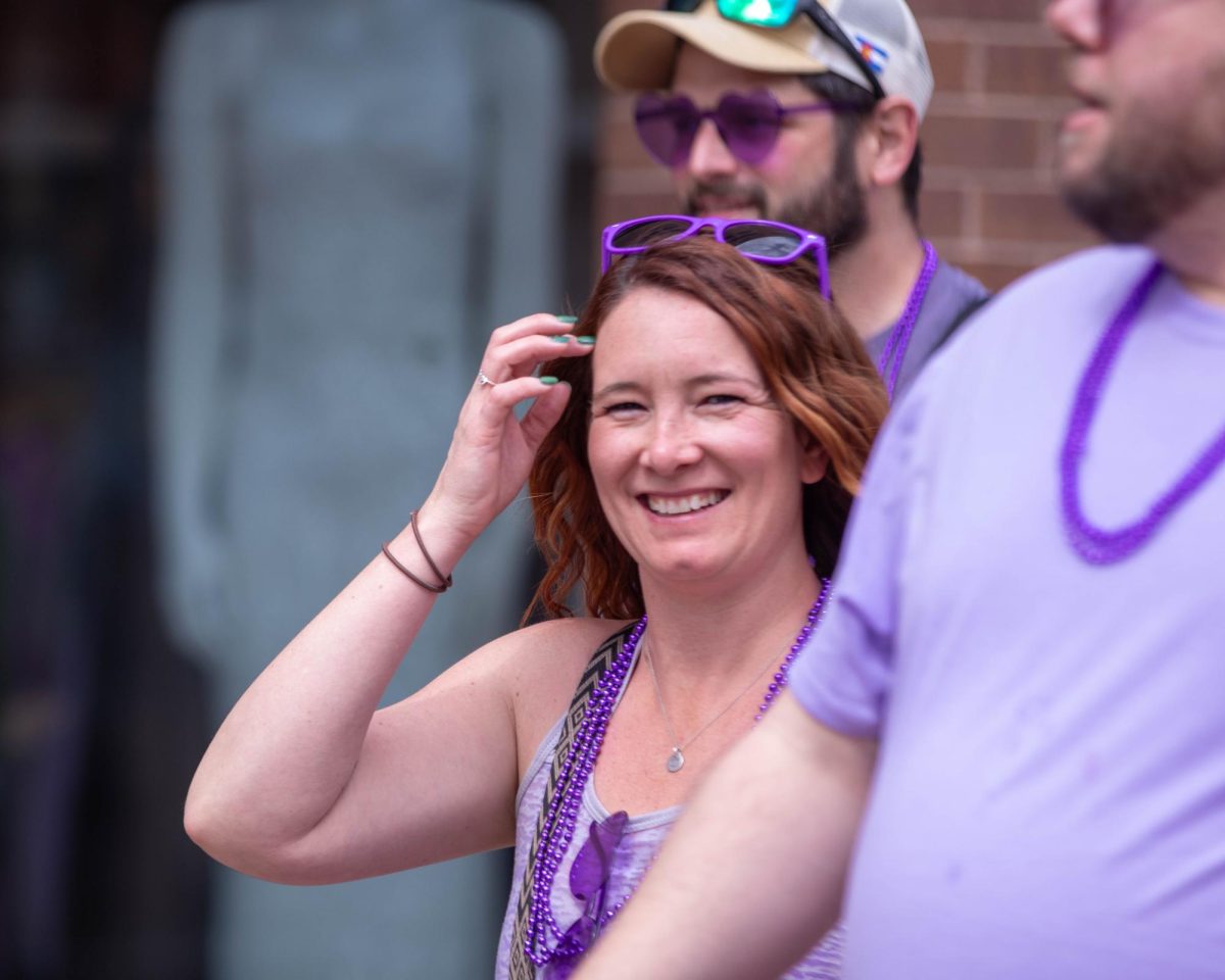 Easter Keg Scavenger Hunt participant laughs during the hunt  in Old Town Fort Collins, March 28.