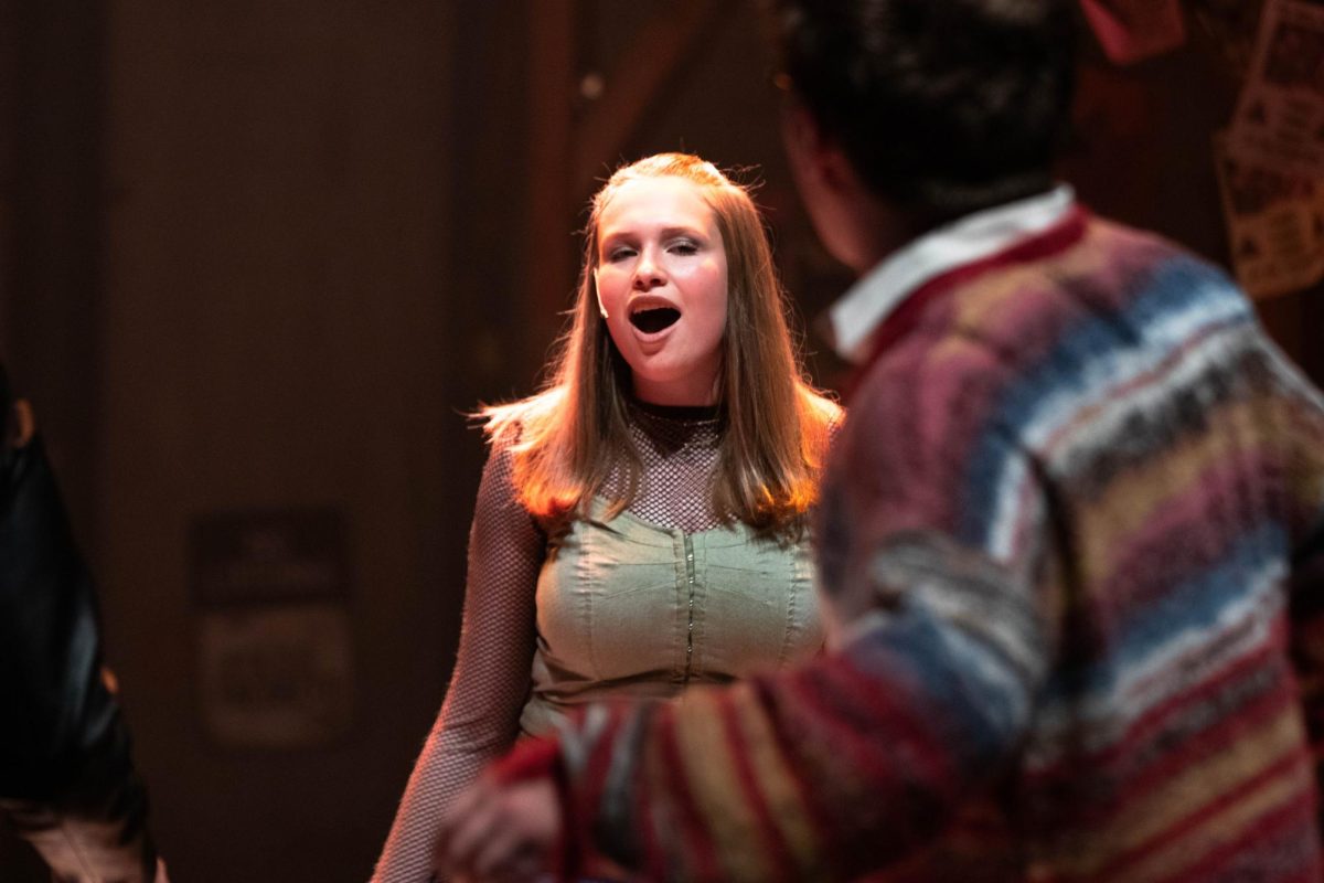Colorado State University actor sings during Rent musical dress rehearsal in the University Center of the Arts, March 5.
