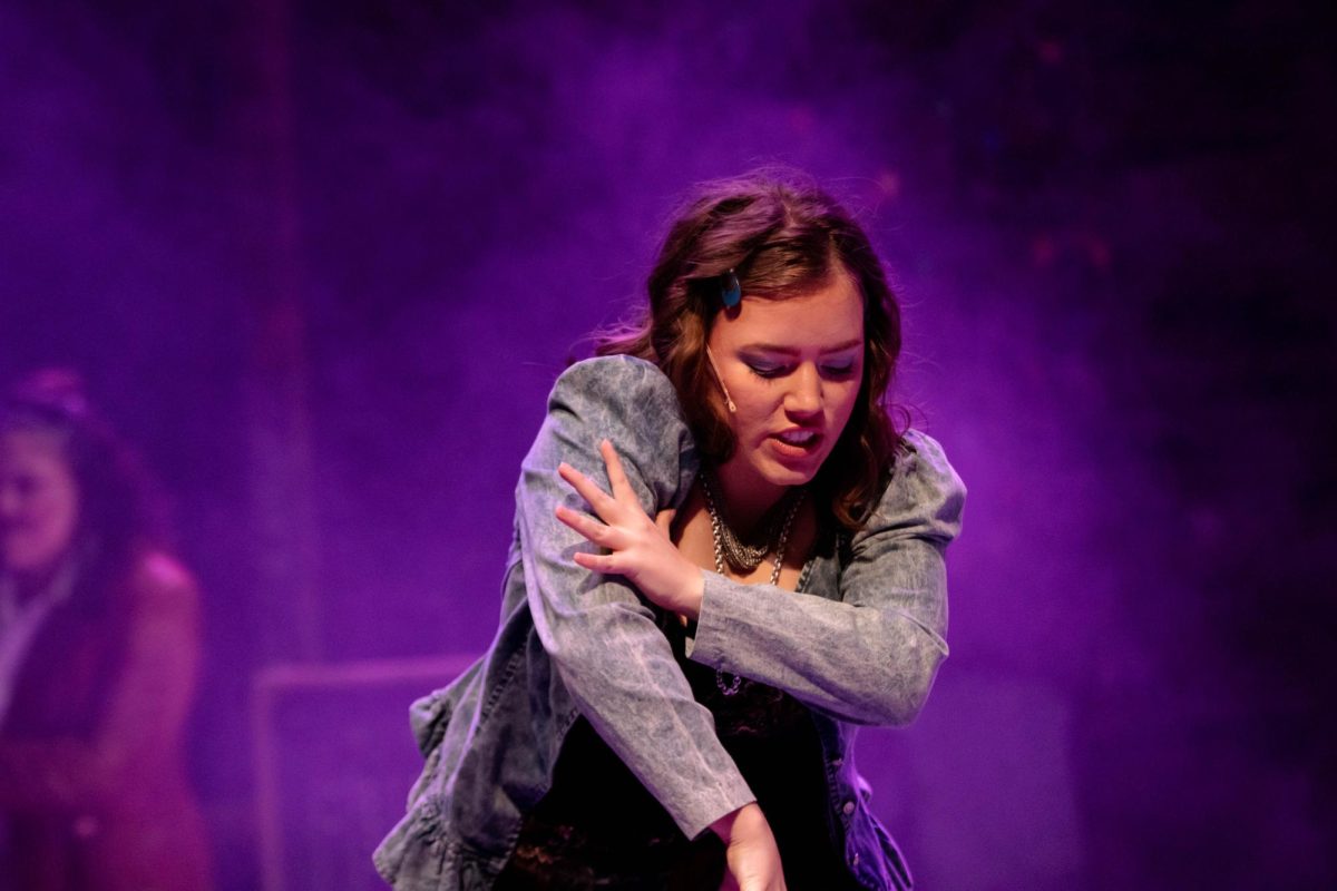 Colorado State University Theater actor dances during scene in Rent musical production dress rehearsal at the University Center of the Arts, March 5.