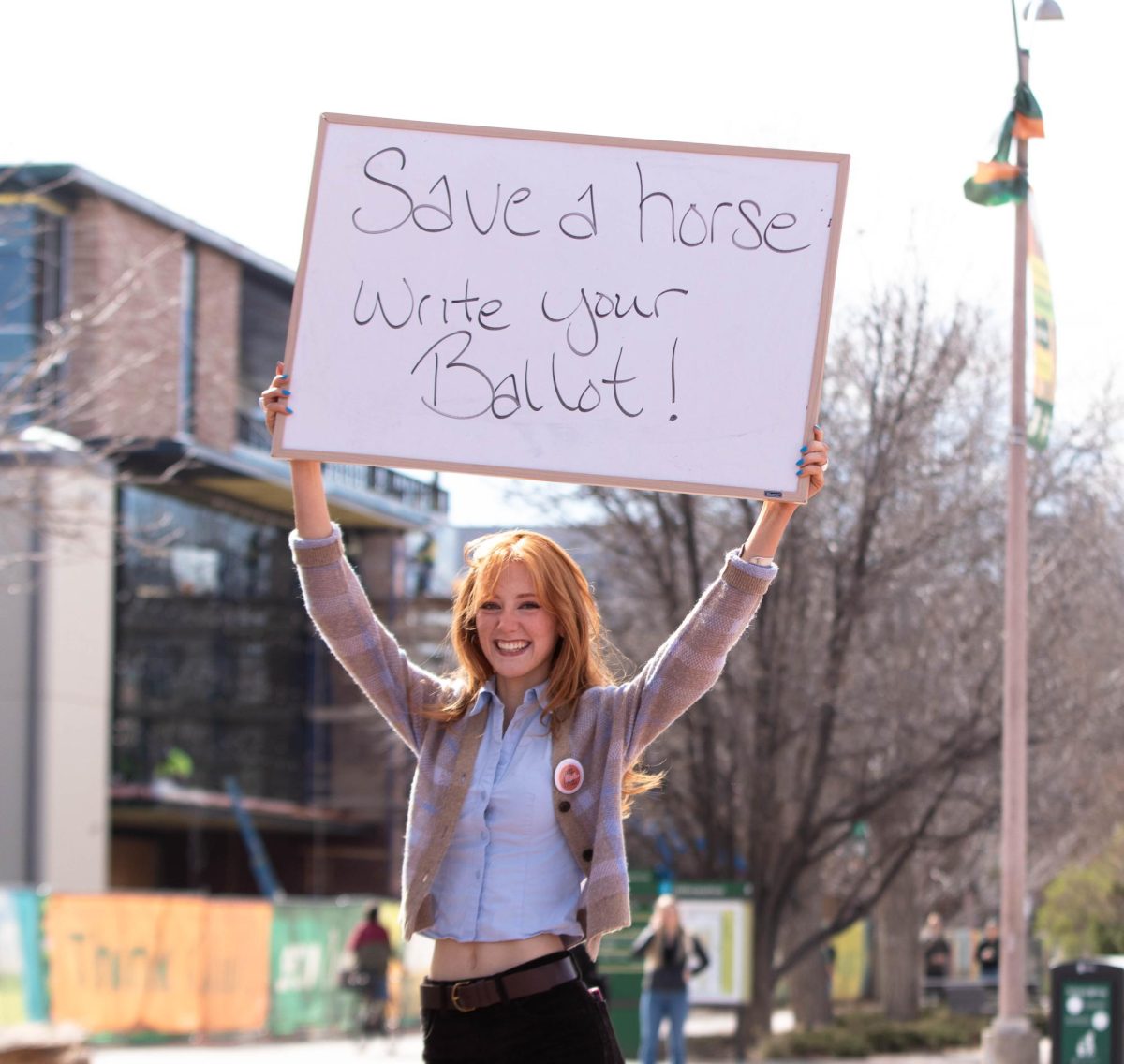 Colorado State University student and ASCSU member encourages students to vote in CSU student elections, on the Lory Student Center plaza, March 10. "I want to support my peers and encourage everyone to vote because it's so important." Said Belen Farfan.