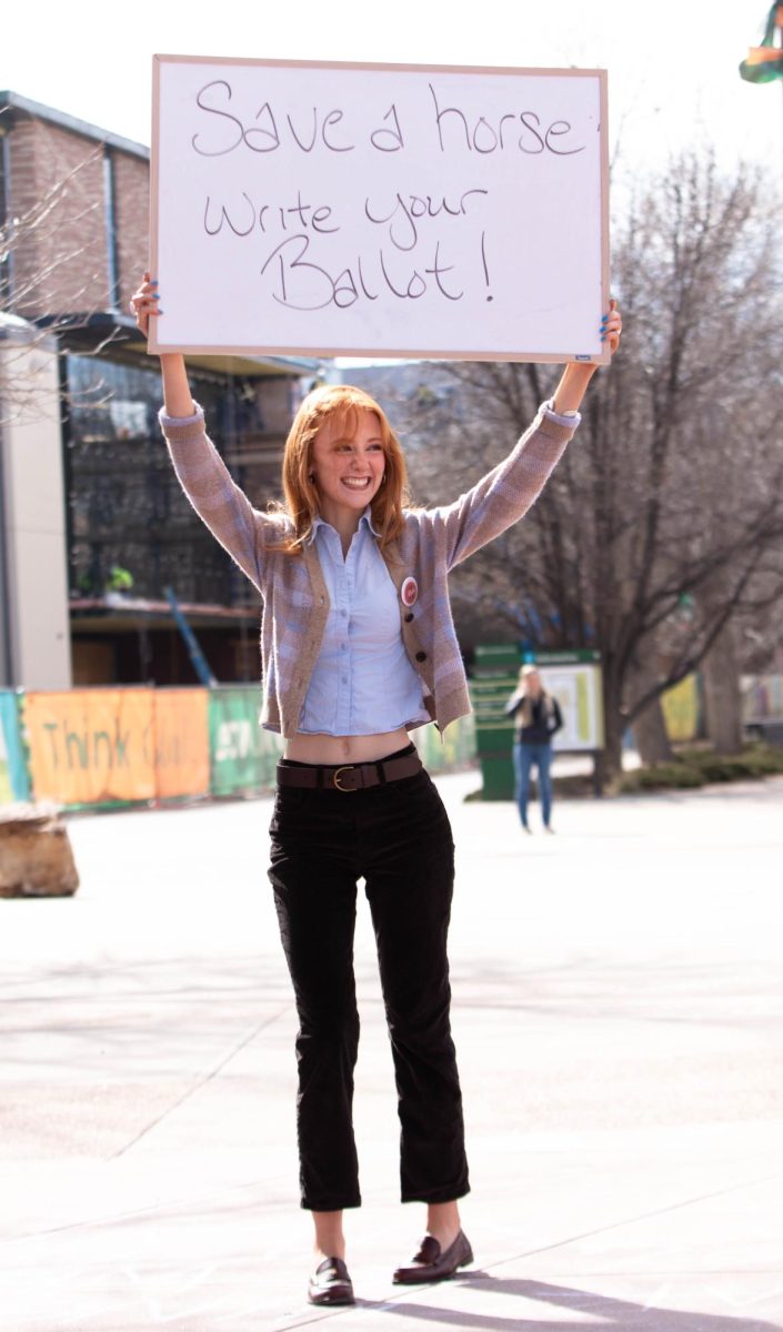 Colorado State University student and ASCSU member encourages students to vote in CSU student elections, on the Lory Student Center plaza, March 10. "I want to support my peers and encourage everyone to vote because it's so important." Said Belen Farfan.
