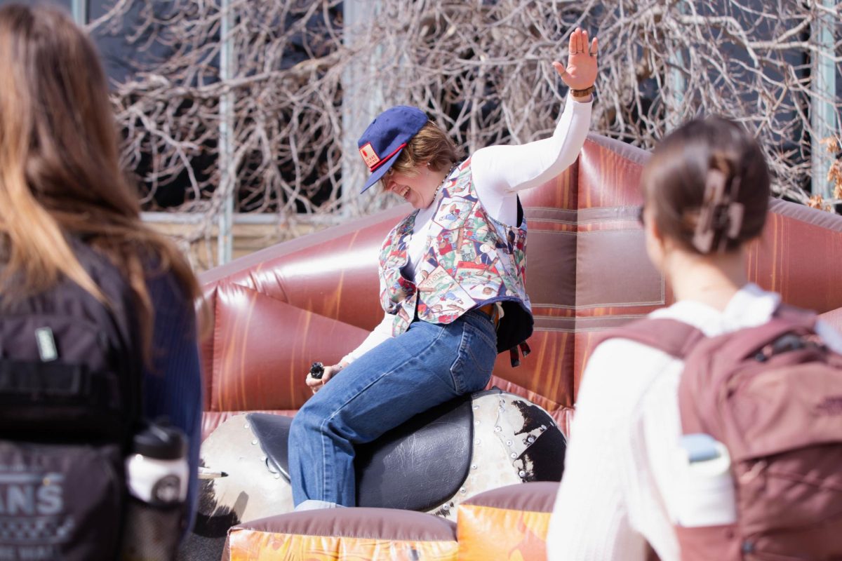 Colorado State University student rides the mechanical bull at ASCSU's Saddle Up and Vote event on the Lory Student Center Plaza, March 10."I honestly like this better than the ice skating, it's more interesting." Said Colorado State University student Abbie Blunt.