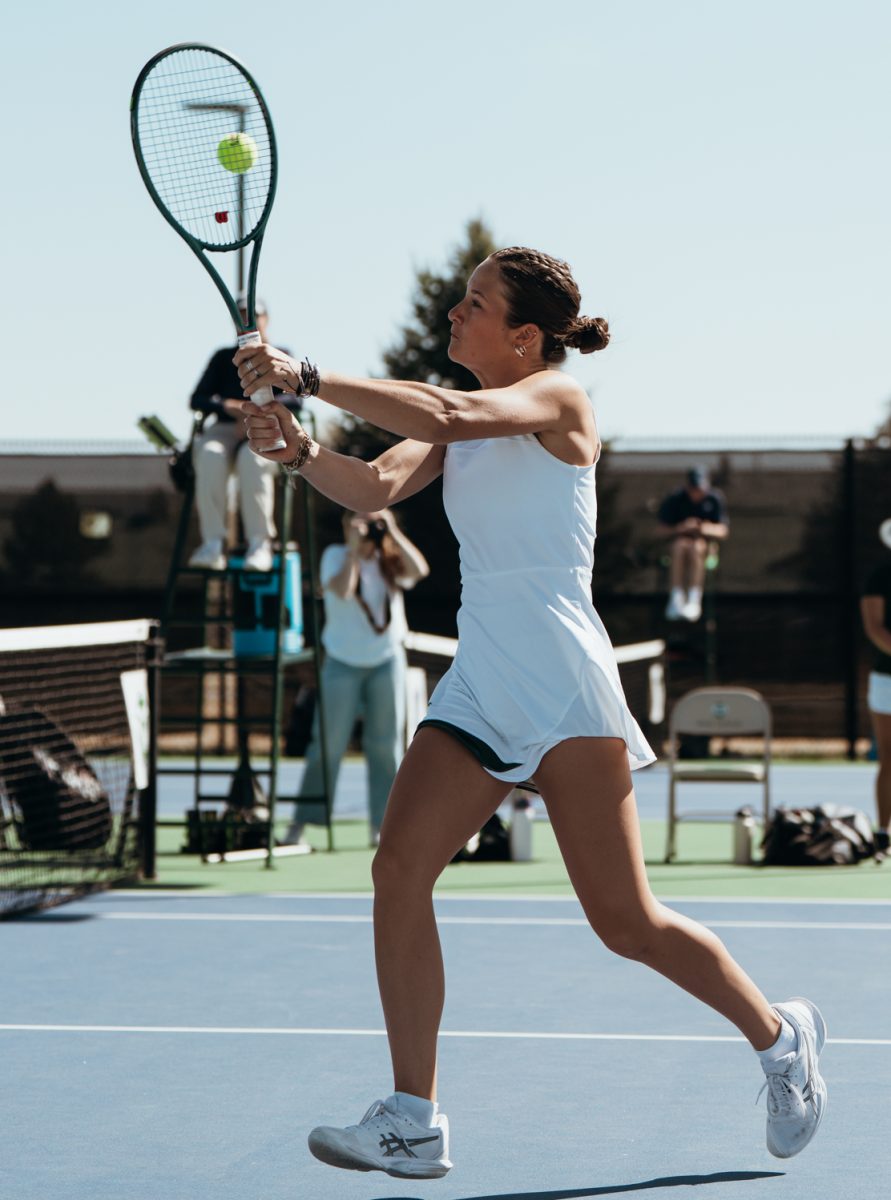 Dylan Voeks, a freshman Colorado State University Womens Tennis player, returns the ball in a match against Fresno State Mar. 29. Colorado State won against Fresno State 4-1.