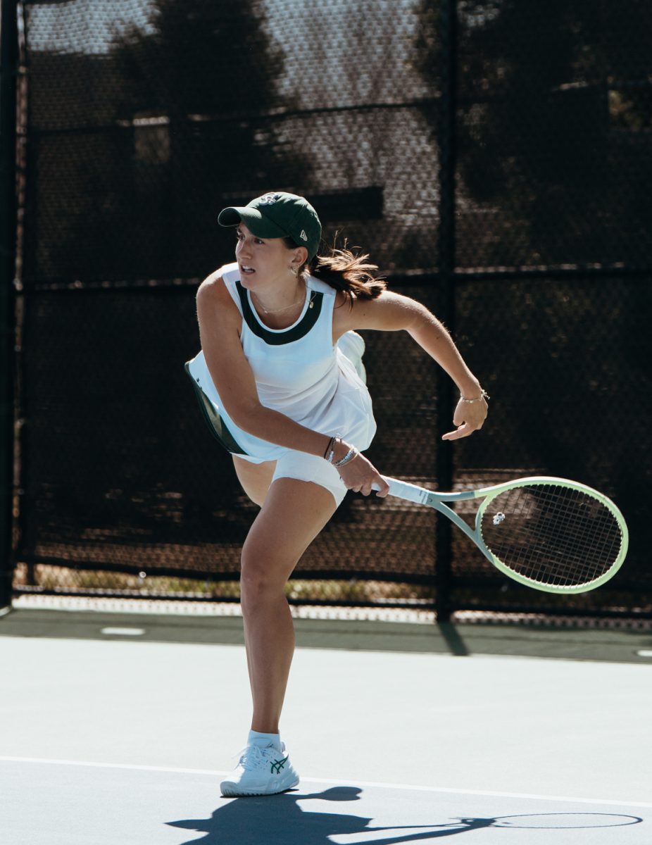Annika Planinsek, a Colorado State University's Womens Tennis player, finishes her serve Mar 29. Colorado State won against Fresno State 4-1.