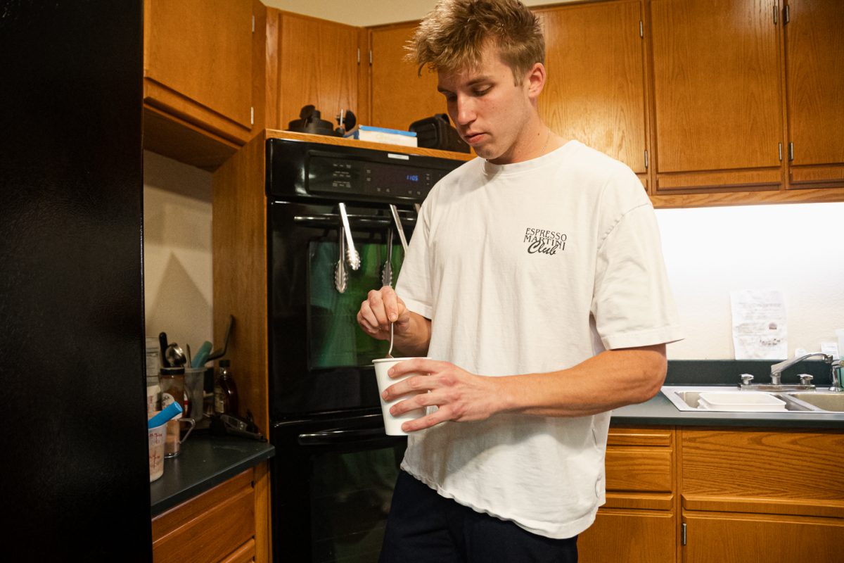 Jacob prepares a drink for a customer right before closing April 1.
