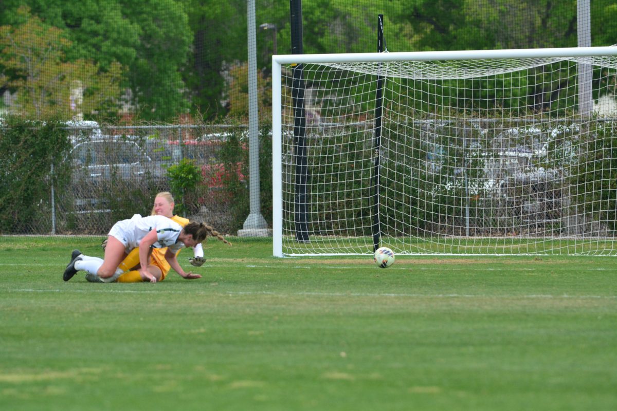 A Colorado State University women's soccer player colliding with University of Northern Colorado to score a goal April 25. This was the fourth goal to win the game for CSU. 