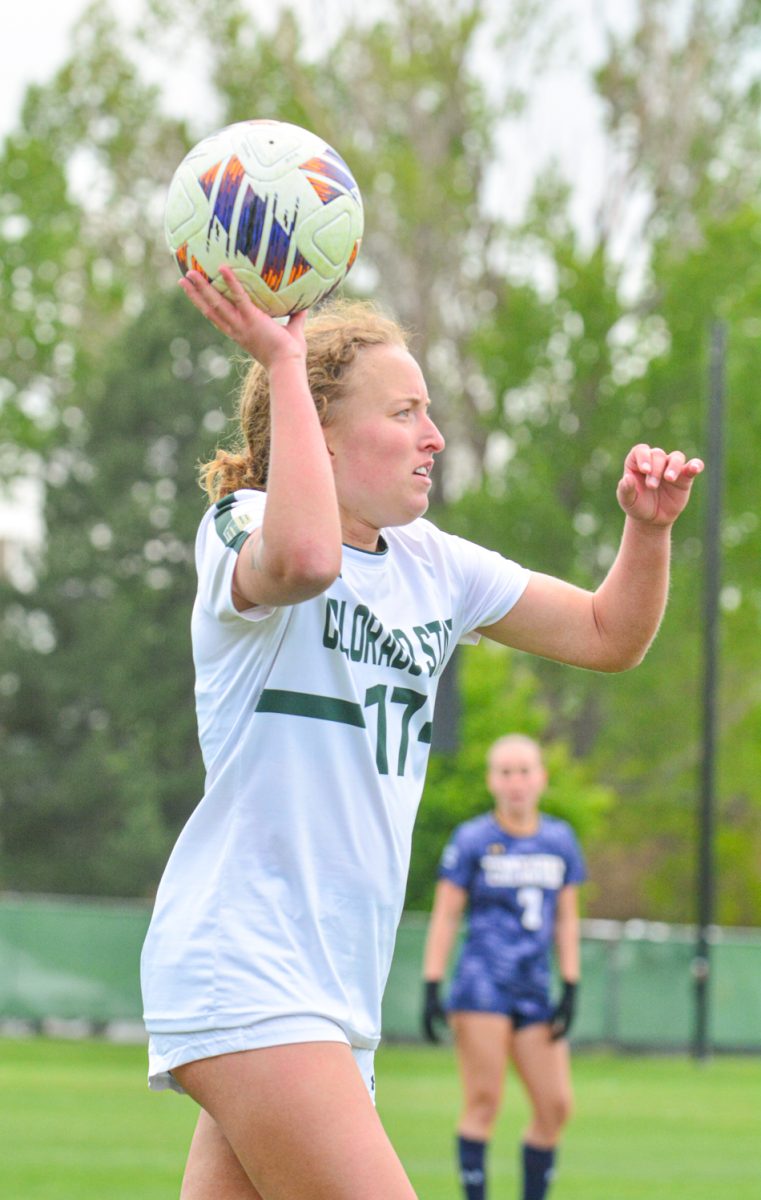 Bridget Arnold throwing the ball into play towards one of her teammates April 25. Bridget and her teammates defeated University of Northern Colorado 4-0. 