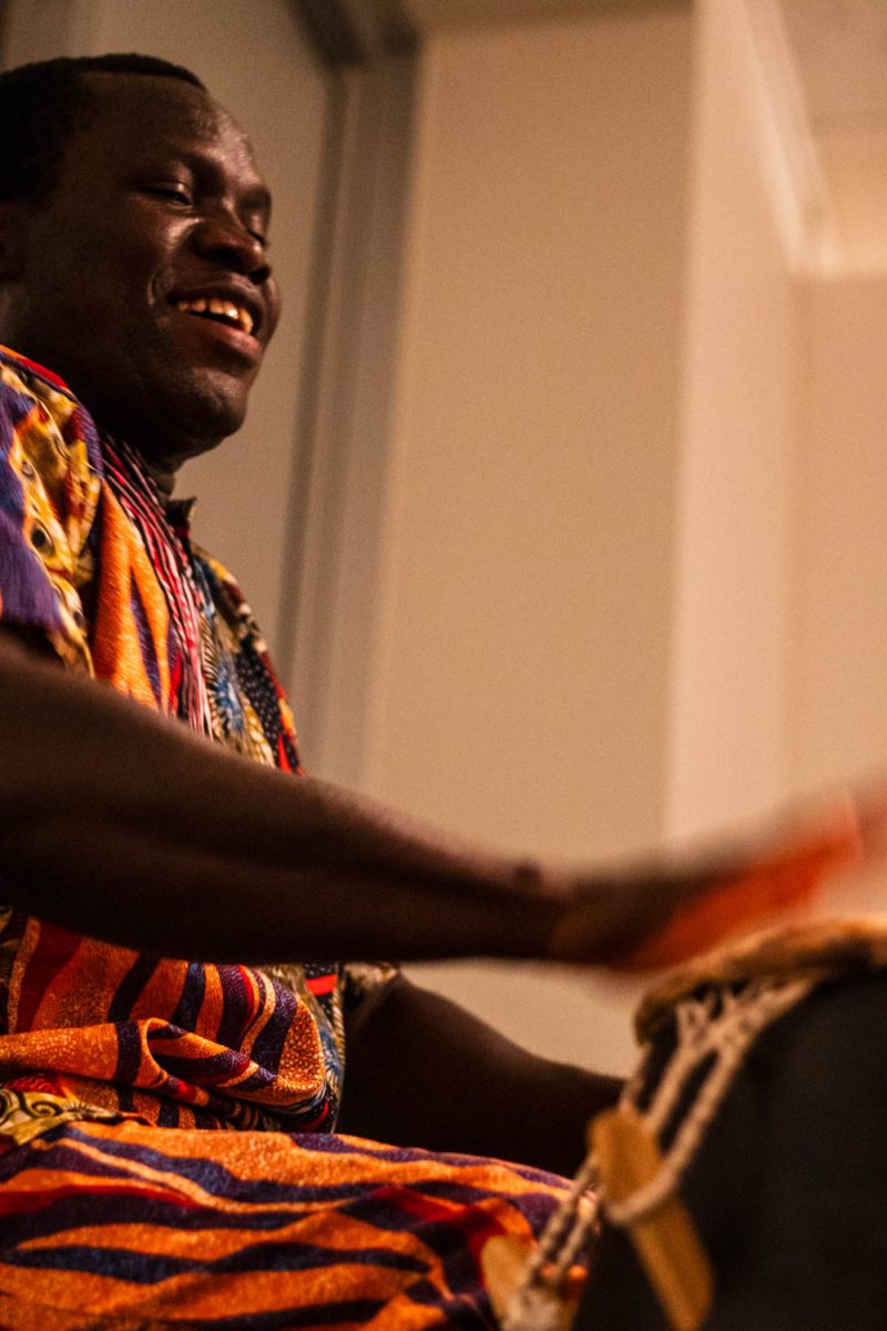 Godwin Abotsi performs the drums at Gifts from Ghana, a celebration where students and instructors share their experiences from their recent trip to Ghana, at the University Center for the Arts April 4.