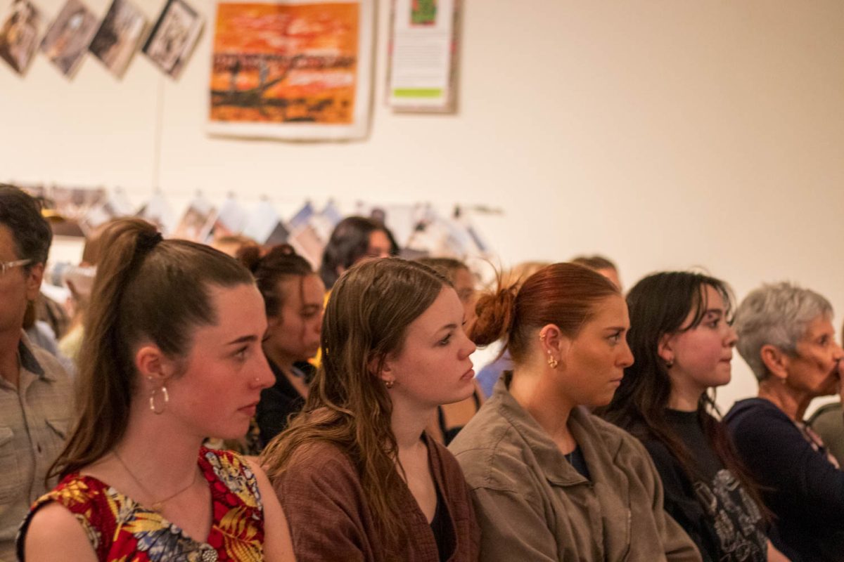 Visitors at the Gifts from Ghana celebration listen during a spoken word presentation in the University Center for the Arts April 4.