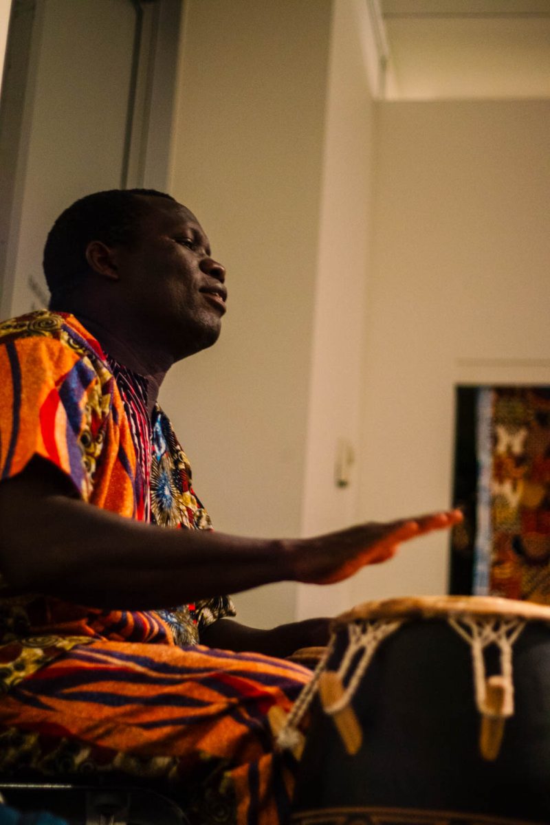 Godwin Abotsi performs the drums at Gifts from Ghana, a celebration where students and instructors share their experiences from their recent trip to Ghana, at the University Center for the Arts April 4.