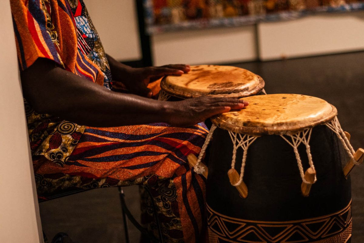 Godwin Abotsi performs the drums at Gifts from Ghana, a celebration where students and instructors share their experiences from their recent trip to Ghana, at the University Center for the Arts April 4.