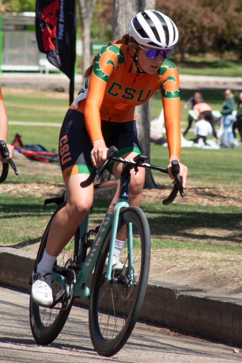 Eleanor ‘Nora’ Dausch, a Colorado State University Club Cycling team member, races around the Oval during the Oval Criterium April 18.