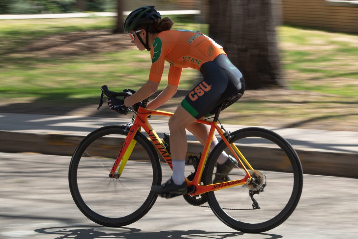 Anna Petr, a Colorado State University Club Cycling team member, races around the Oval during the Oval Criterium April 18.