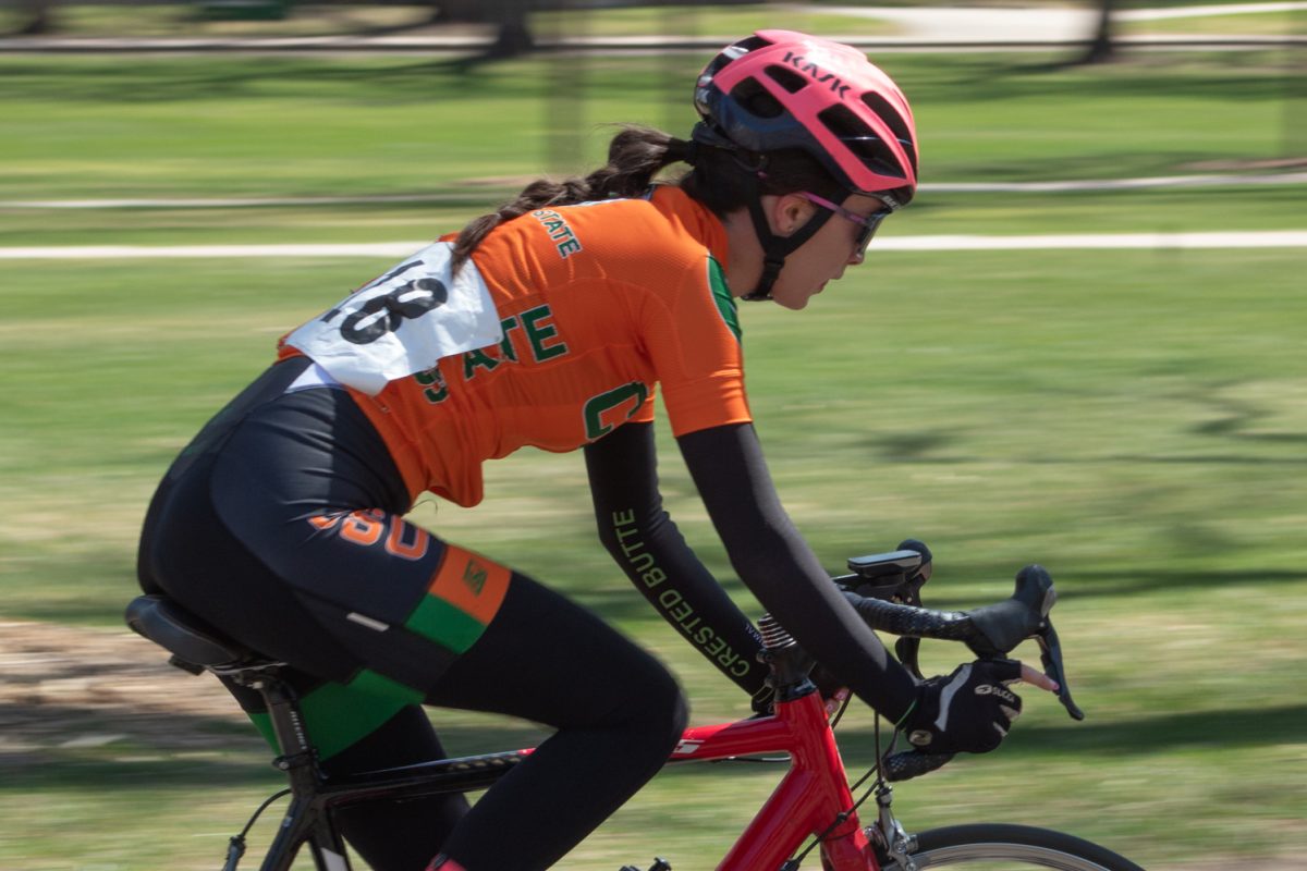 Olivia Gordon, a Colorado State University Club Cycling team member, races around the Oval during the Oval Criterium April 18.