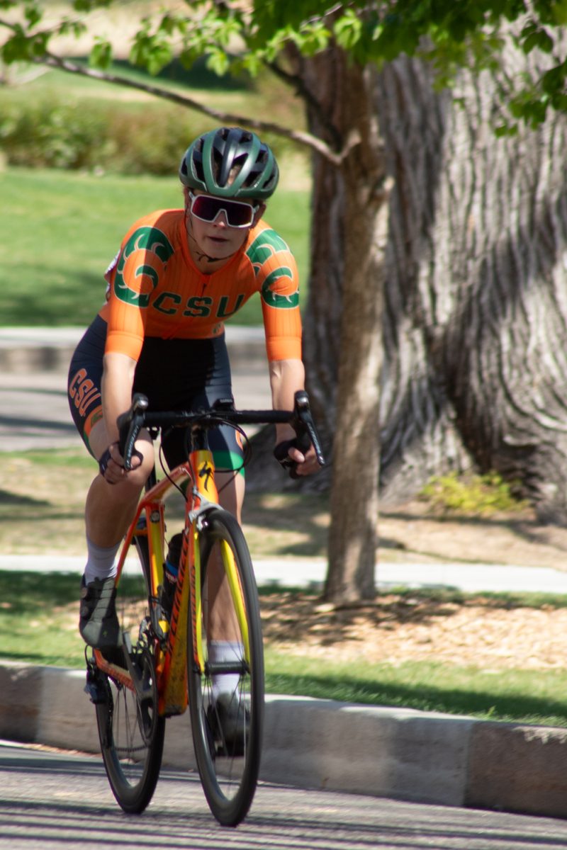 Anna Petr, a Colorado State University Club Cycling team member, races around the Oval during the Oval Criterium April 18.