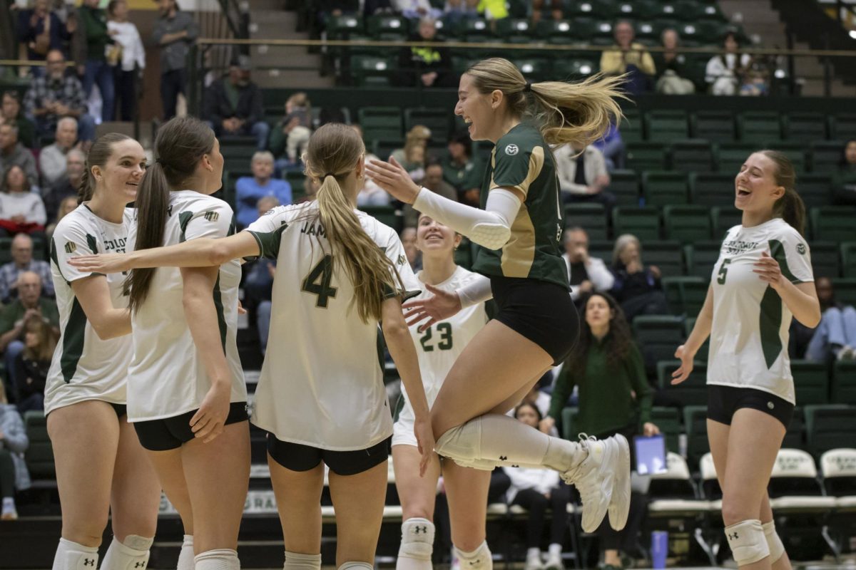 Karsyn Fetzer (1) celebrates a point with her teamates during a scrimmage game. Colorado State University played Denver University and Colorado University in Moby Arena, April 4th.