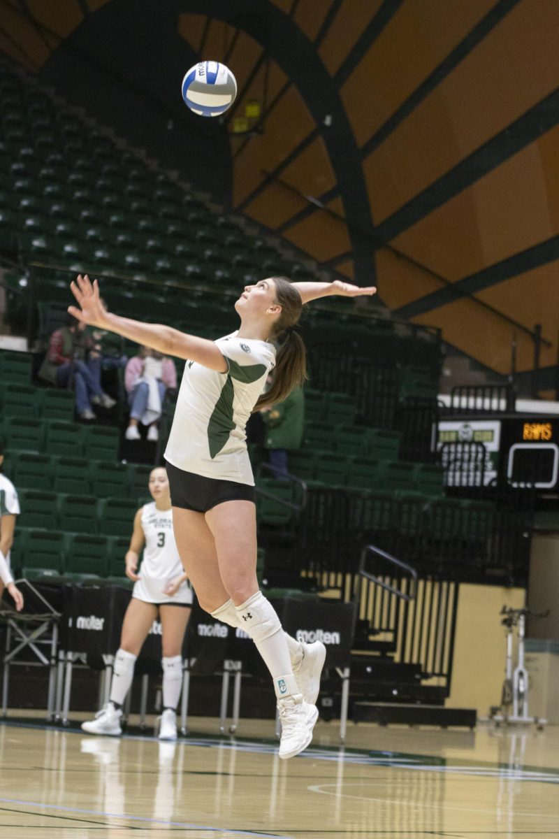 Silvie Graetzer (9) serves ball in scrimmage game. Colorado State University played Denver University and Colorado University in Moby Arena, April 4th.