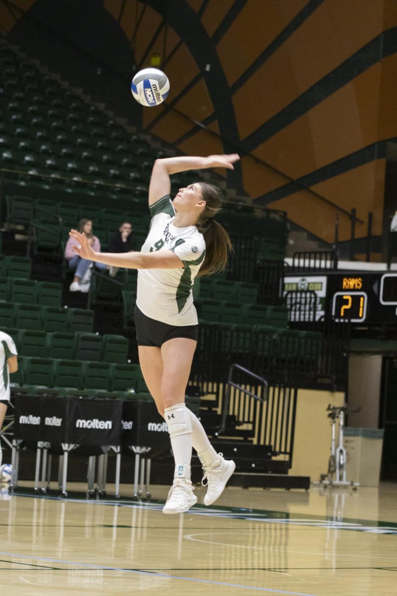 Silvie Graetzer (9) serves ball in scrimmage game. Colorado State University played Denver University and Colorado University in Moby Arena, April 4th.