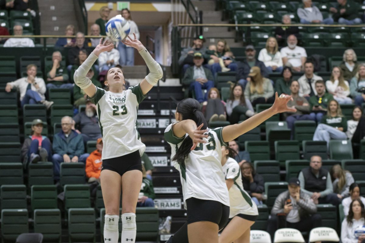 Erin Debiec (23) sets a ball in scrimmage game. Colorado State University played Denver University and Colorado University in Moby Arena, April 4th.