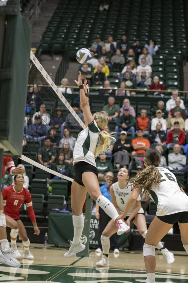 Brenna Rowland (10) attemps to block a ball in scrimmage game. Colorado State University played Denver University and Colorado University in Moby Arena, April 4th.
