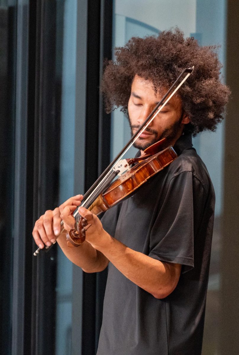 Philip Cutler, a violinist and son of the event’s curator, Cutler participated in the evening's exhibition to support his mom and get a chance to play the violin, April 24. While he jumped at the chance to support his family and play some music, he was less certain of how impactful the event would be. “I wanted to support my mom as she ran the event, but I also get to get out and play the violin every now and then,” Cutler said. “As things that are actually going to motivate people to be invested in their community and themselves, I don’t know if this necessarily has a direct enough impact.”