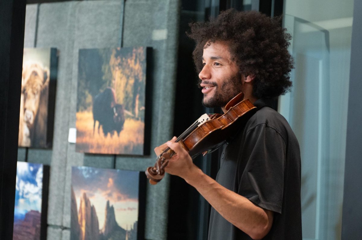 Philip Cutler, a violinist and son of the event’s curator, Cutler participated in the evening's exhibition to support his mom and get a chance to play the violin, April 24. While he jumped at the chance to support his family and play some music, he was less certain of how impactful the event would be. “I wanted to support my mom as she ran the event, but I also get to get out and play the violin every now and then,” Cutler said. “As things that are actually going to motivate people to be invested in their community and themselves, I don’t know if this necessarily has a direct enough impact.”