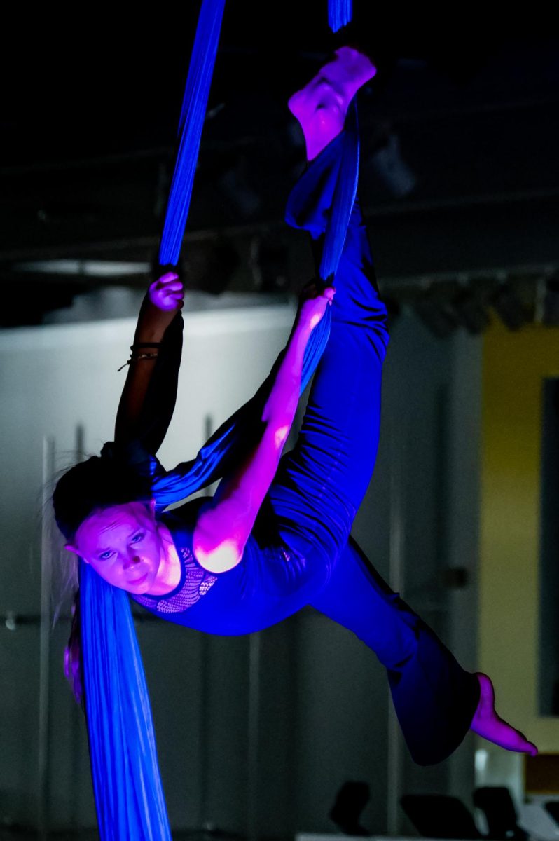 Finn Boyle, young aerialist and performer in a traveling trapeze troupe, performs her aerial piece as part of the exhibitions events, April 24. Boyle was excited to participate the exhibition, as she believes that art is a beautiful and fulfilling experience that contributes positively to the community. “I really like bringing everybody together, and showing people that art is one of the most beautiful,” Boyle said. “It just makes me feel really happy, and it fills me with joy. I like the buildup. I like the build up and I like the stomach drop, and like before and after. It’s just super amazing.”