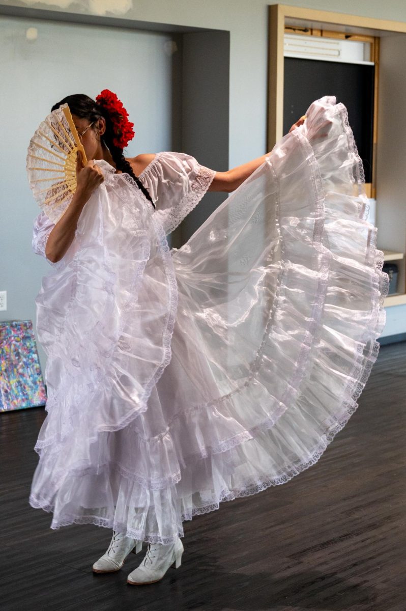 Veronica Wilson, a Baile Folklo Rico dancer, practices her performance for the evening of art and live experiences held at the foothills mall April 24. Wilson uses her art to tell stories, and to express her feelings around herself and her religion. “When I did my dance I wanted to show a story in it,” Wilson said. “At the beginning I was hiding my face, hiding myself, and I think it was a form of shame. As I’m dancing it’s a way of me learning that I don’t have to hold onto that shame, and I can give it to [God]. And so at the end I am able to reveal myself.”