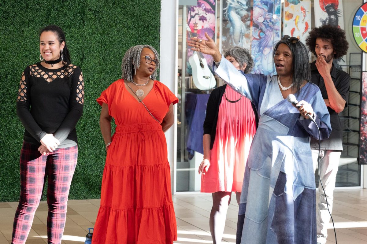 Lousie Cutler, the curator of the event and herself an artist, introduces the event’s line up of artists and the reasons she brought everyone together, April 24. Louise wanted to find a way to breathe some life into the once busy mall and in doing so bring the community together. “There is no such thing as an unoccupied space, just a space waiting on the imagination to fill it,” Cutler said.