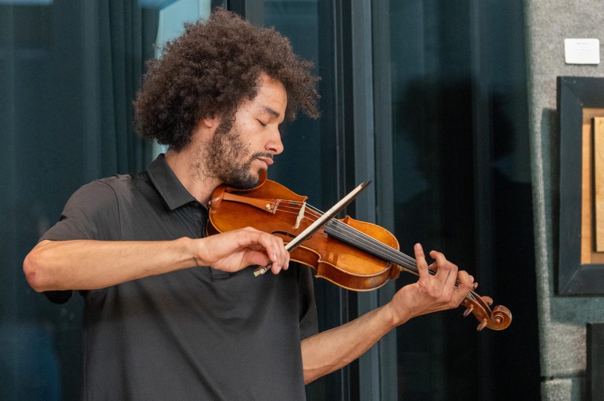 Philip Cutler, a violinist and son of the event’s curator, Cutler participated in the evening's exhibition to support his mom and get a chance to play the violin, April 24. While he jumped at the chance to support his family and play some music, he was less certain of how impactful the event would be. “I wanted to support my mom as she ran the event, but I also get to get out and play the violin every now and then,” Cutler said. “As things that are actually going to motivate people to be invested in their community and themselves, I don’t know if this necessarily has a direct enough impact.”