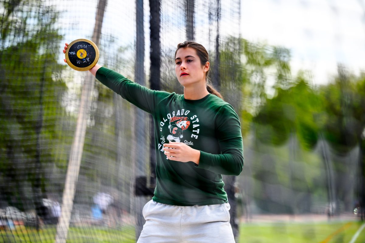 Colorado State University track and field athlete Klaire Kovatch swings her arm to warm up for her discus throw during CSU's Border Dual Meet April 25. Kovatch finished first with a mark of 55.42 meters.