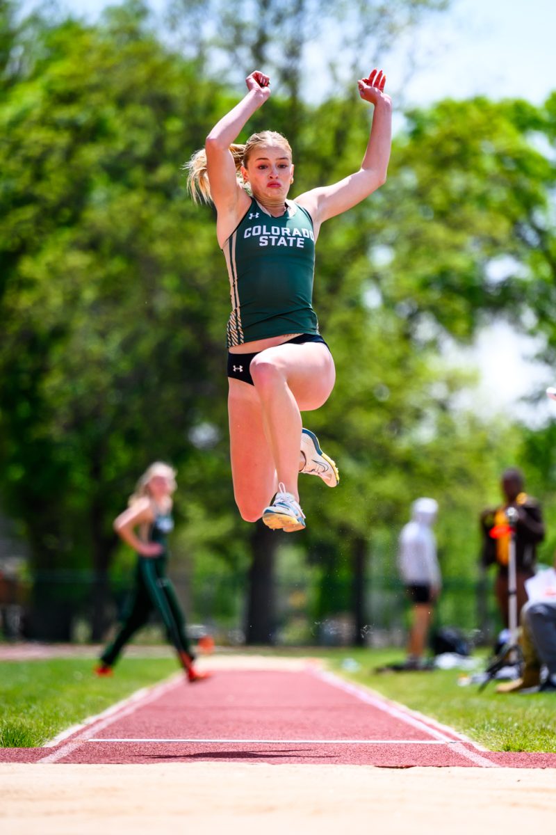 Colorado State University track and field athlete Italia Bradford leaps into the sand pit during the women's long jump event at CSU's Border Dual Meet April 25.