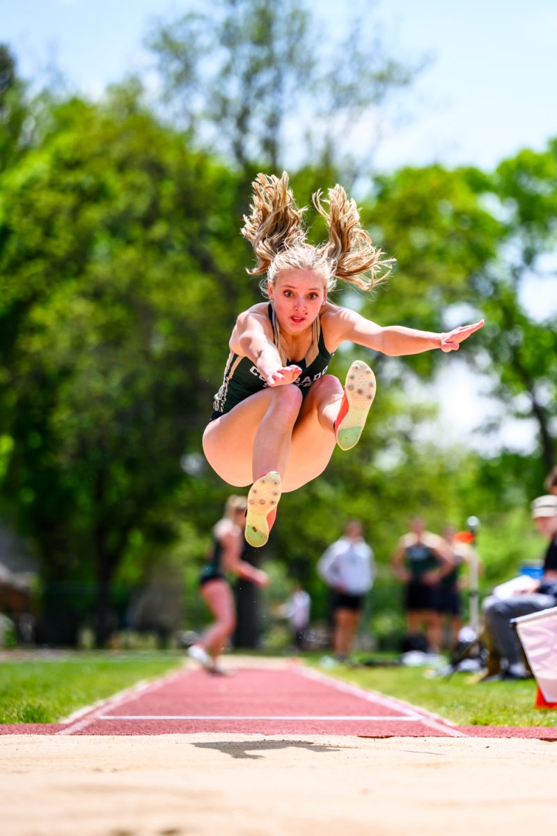 Colorado State University track and field athlete Kylee Kielian jumps into the sand pit during women's long jump at CSU's Border Dual Meet April 25. Kielian finished third with a mark of 5.32 meters.